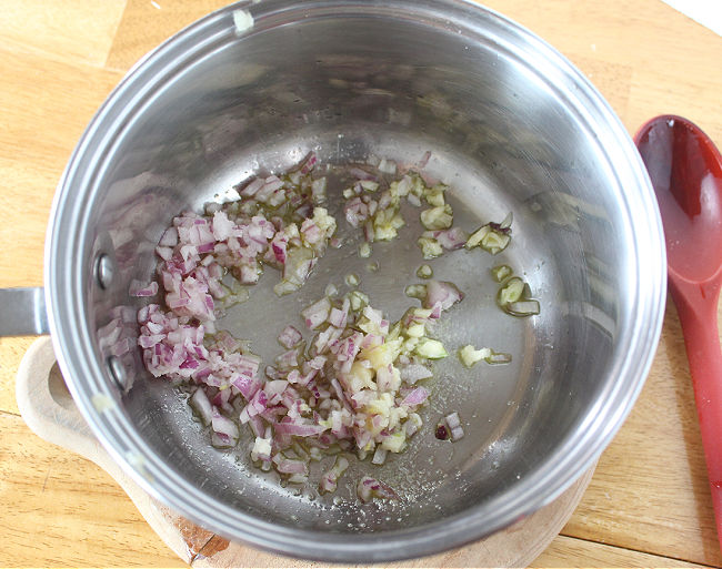 Onion and garlic in a steel saucepan.