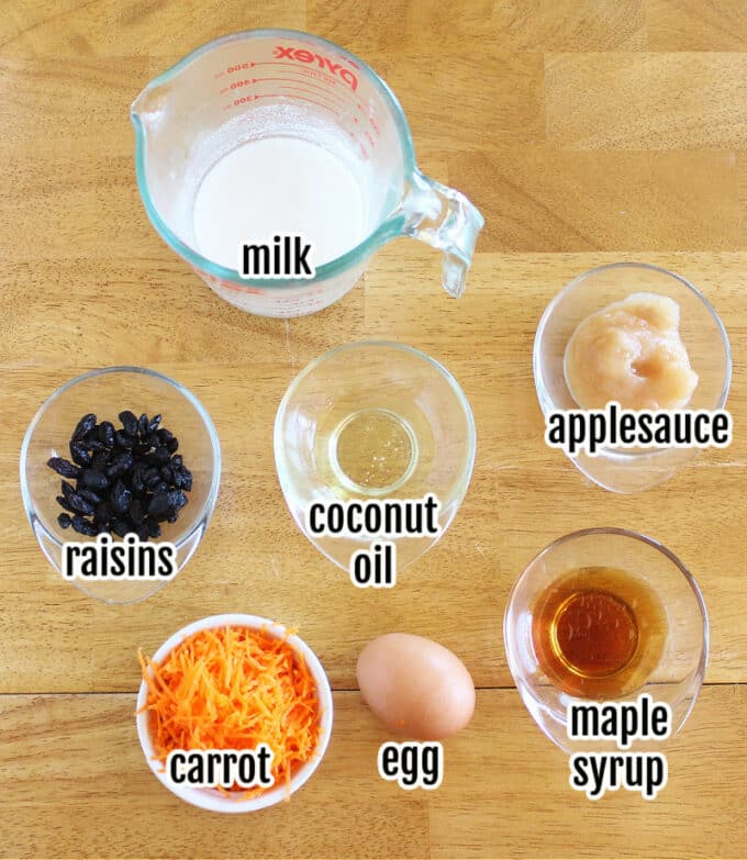 Ingredients on a table, including milk, egg, and carrot.