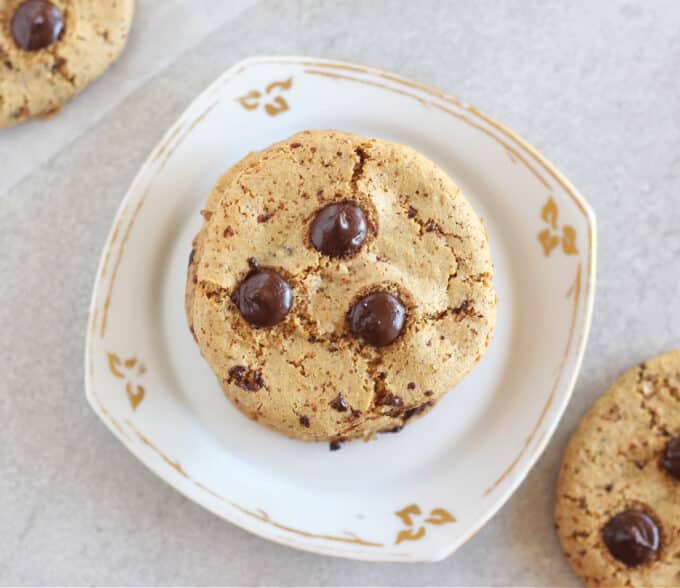 Top down look at a stack of chocolate chip cookies.