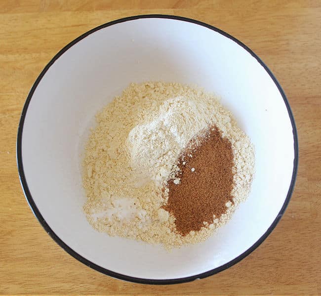 Flour and sugar in a large white bowl.