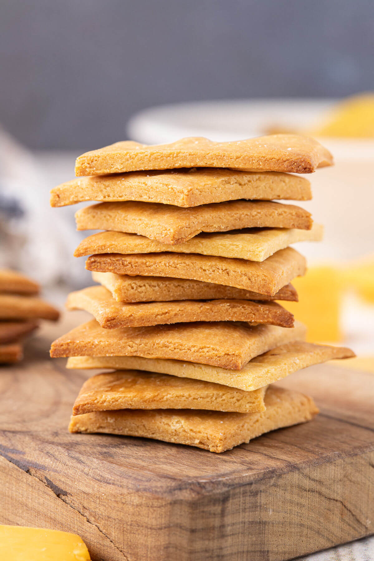 Stack of crackers on a cutting board.