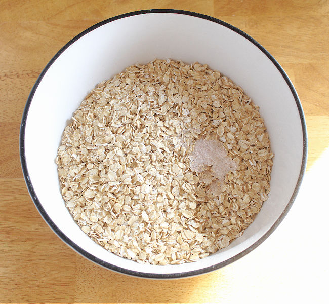 Rolled oats in a large white bowl.