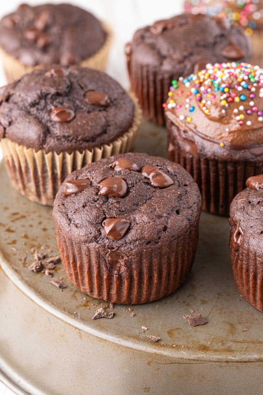 Chocolate cupcakes on a stand.