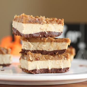 Stack of homemade candy bars on a white plate.