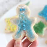 Gingerbread boy decorated with blue sprinkles.