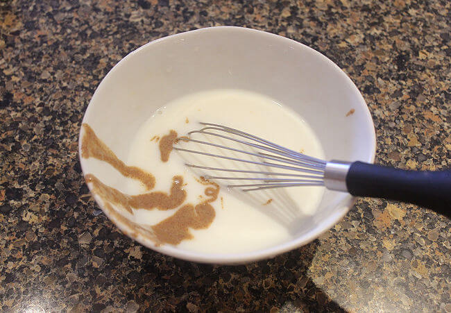 Milk and almond butter mixed in a bowl.
