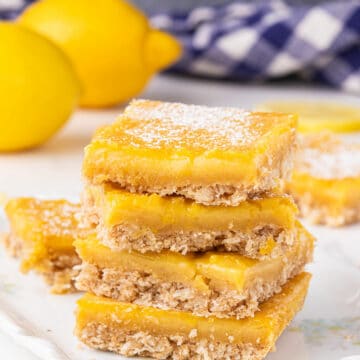 Stack of lemon bars on a plate.