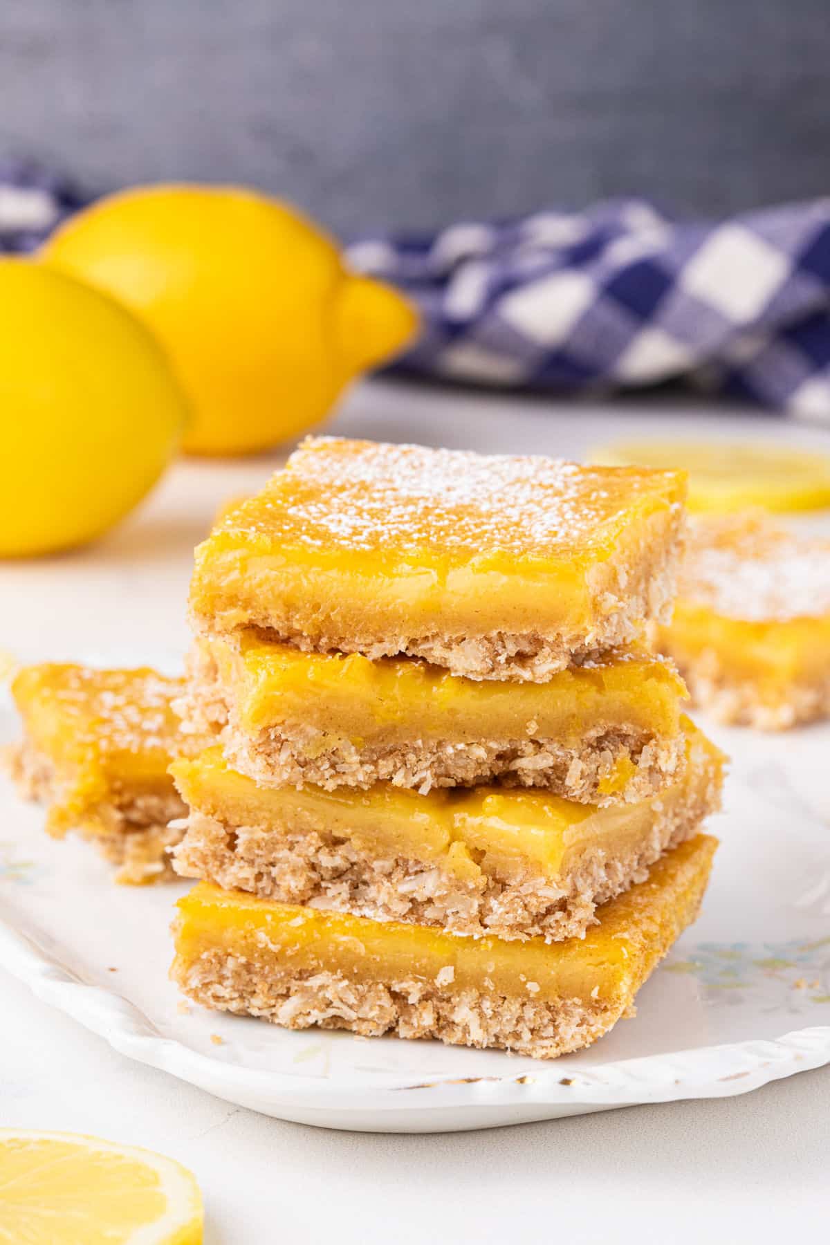 Stack of lemon bars on a plate.