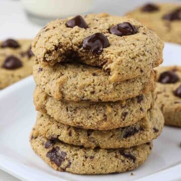 Stack of five cookies on a plate.