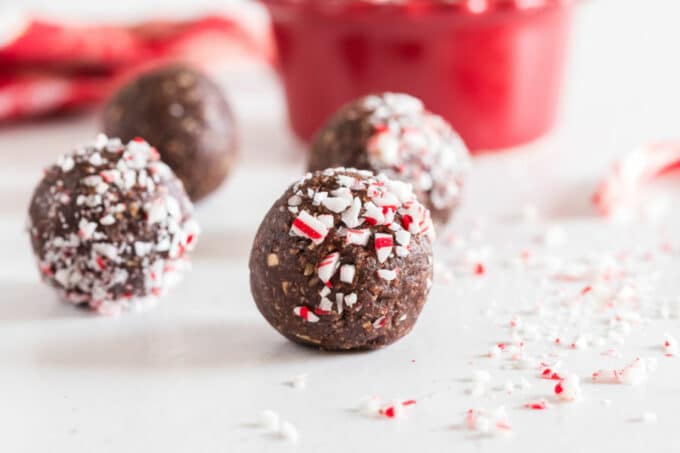 No-bake chocolate ball with candy canes on a countertop.