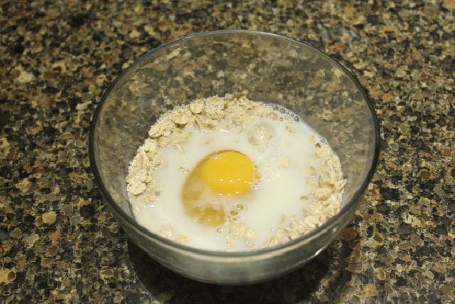 Ingredients for oatmeal pancakes in a bowl.