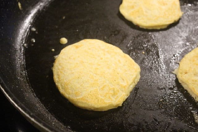 Oatmeal pancakes in a non-stick skillet.