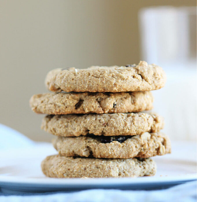 Stack of oatmeal raisin cookies on a plate.