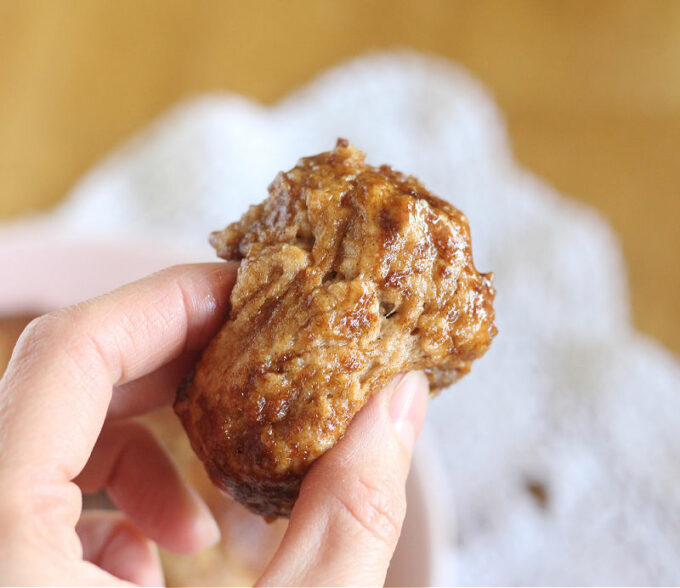 Chunk of luscious baked dough covered with butter and cinnamon sugar.