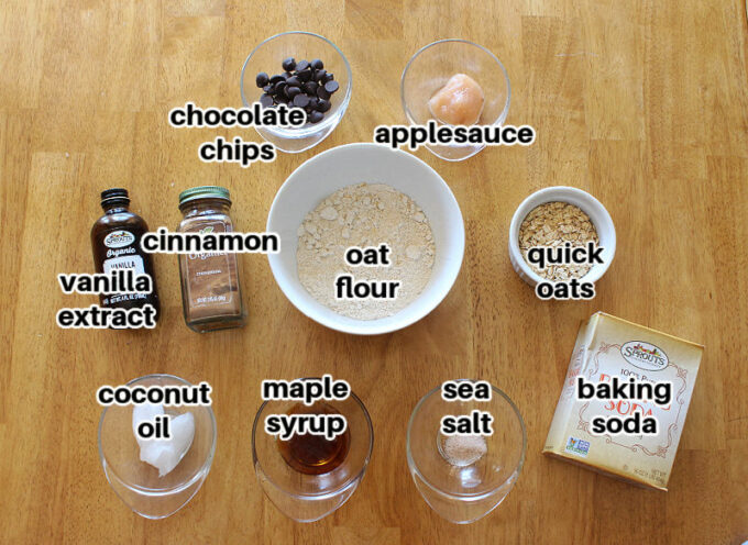 Ingredients laid out on a table, including oat flour, oats, and coconut oil.