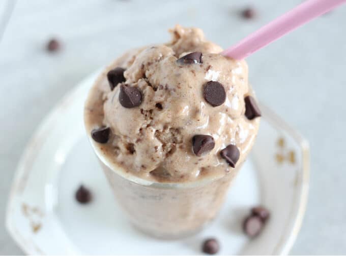 Close-up of ice cream and chocolate chips in a glass.