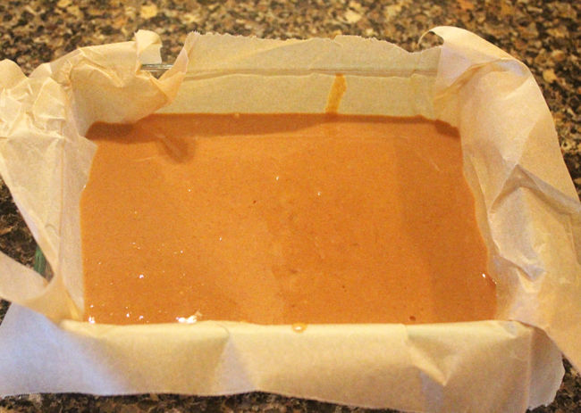 Peanut butter poured into a small rectangular dish.