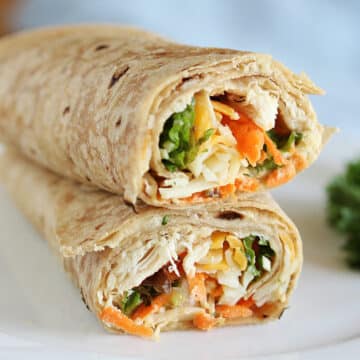 Two chicken wraps stacked on top of each other.