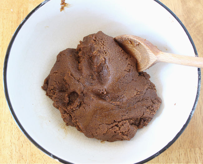 Ginger cookie dough in a white bowl.