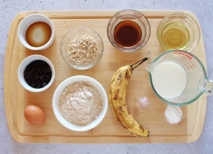 Banana chocolate chip muffin ingredients laid out on a table.