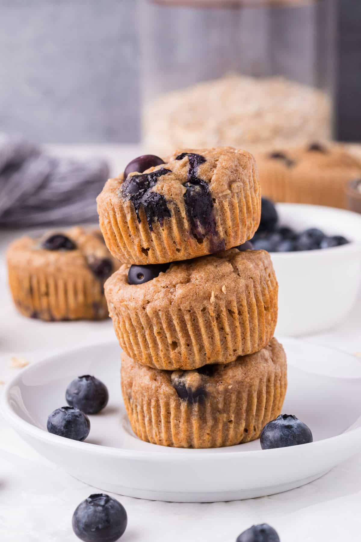 Stack of three blueberry muffins.
