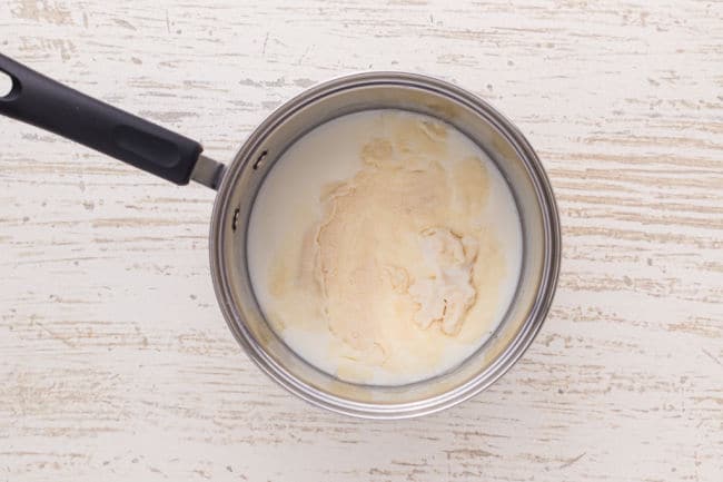 Blooming gelatin in milk in a saucepan.