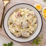 Potato salad with eggs in a bowl.