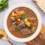 Beef stew with potatoes and carrots in a bowl.