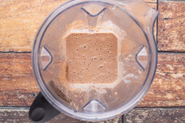 Blended chocolate smoothie in a blender.