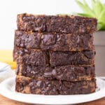 Stack of banana bread slices on a plate.