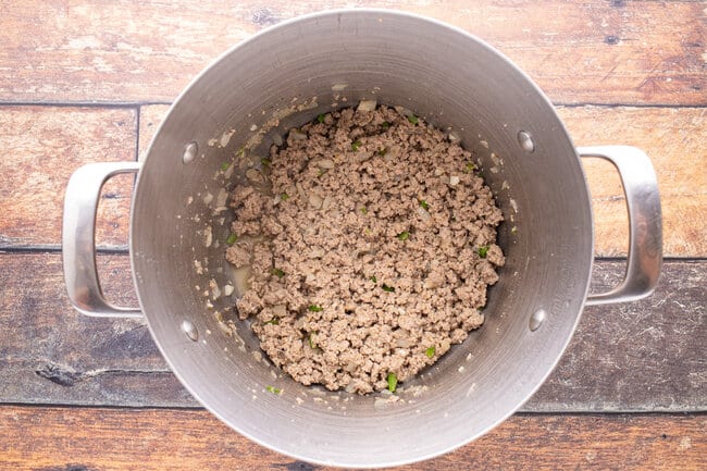 Ground turkey in a large pot.