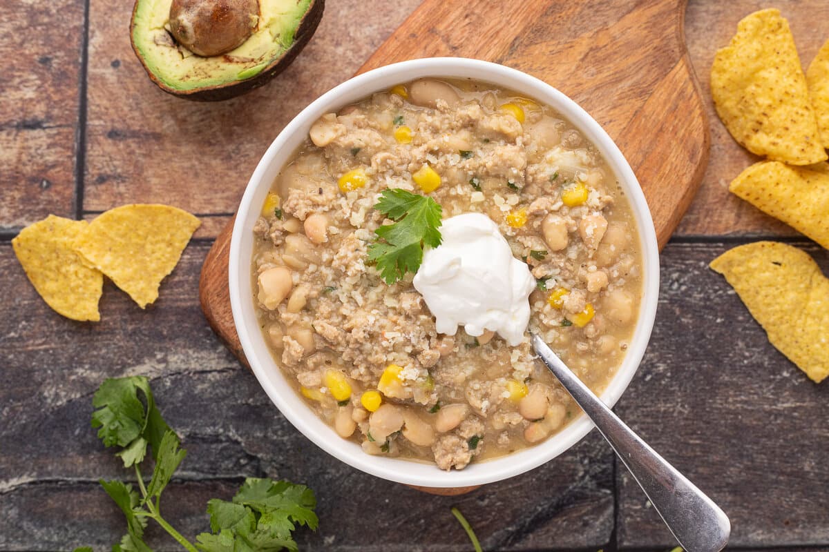 Turkey chili with sour cream and cilantro on top.