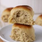 Stack of two dinner rolls on a plate.