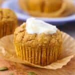 Pumpkin muffin on a board.